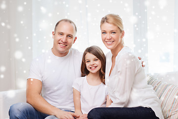 Image showing smiling parents and little girl at home