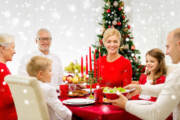 Image showing smiling family having holiday dinner at home