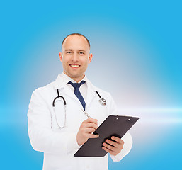 Image showing smiling male doctor with clipboard and stethoscope