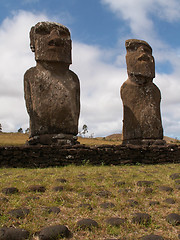 Image showing Pair Of Moai Against Blue Sky