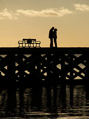 Image showing Kissing Couple Silhouette On A Pier