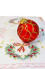 Image showing Red Christmas ball embroidered napkin isolated