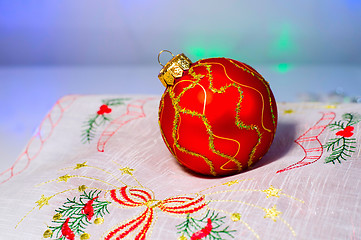 Image showing Red Christmas ball on a napkin