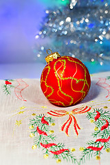 Image showing Red Christmas ball on a napkin