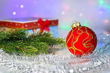 Image showing Red Christmas ball, fir branch and with gift box