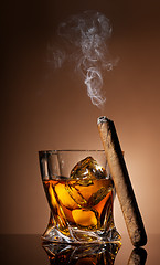 Image showing Glass of whiskey and cigar