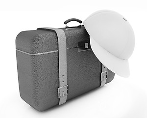 Image showing Brown traveler's suitcase and peaked cap 