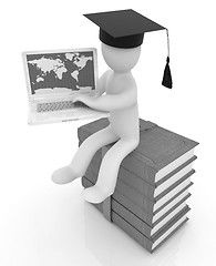 Image showing 3d man in graduation hat sitting on books and working at his lap