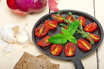 Image showing baked cherry tomatoes with basil and thyme