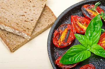 Image showing baked cherry tomatoes with basil and thyme