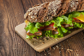 Image showing Sandwich on the wooden table