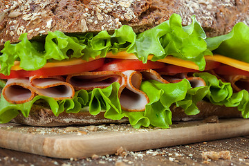 Image showing Sandwich on the wooden table