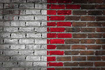 Image showing Brick wall texture with flag