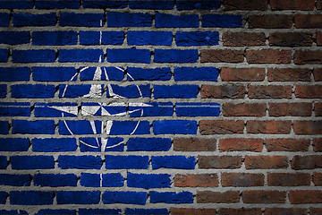 Image showing Brick wall texture with flag