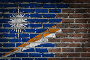 Image showing Brick wall texture with flag