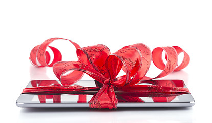 Image showing tablet pc with christmas decorations on white background