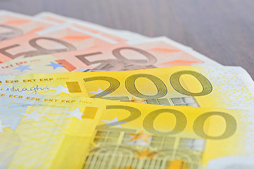 Image showing Close-up of 200 and 50 Euro banknotes on the table