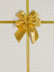 Image showing  gift bow with golden satin ribbon