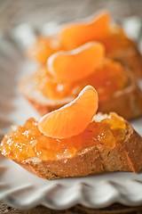 Image showing pieces of baguette with orange marmalade