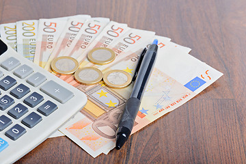 Image showing Calculator and money on the table