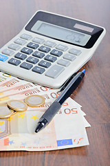 Image showing Calculator and money on the table