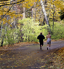 Image showing Man and woman running