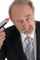 Image showing Businessman dart gun