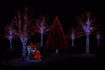 Image showing Illuminated Snowman and  trees 