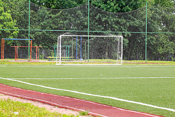 Image showing Football goal on a green field on a background