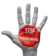 Image showing Stop Procrastinating Sign Painted, Open Hand Raised.