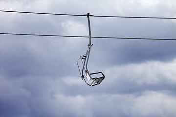 Image showing Chair-lift and overcast gray sky