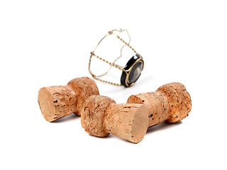 Image showing Three corks from champagne wine and muselet isolated on white ba