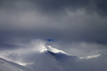 Image showing View on off-piste slope in storm clouds