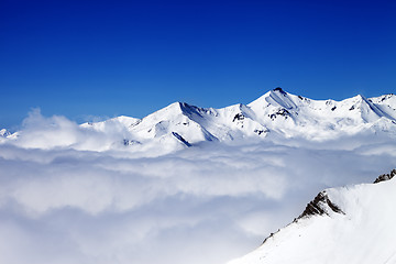 Image showing Winter snowy mountains under clouds at nice day