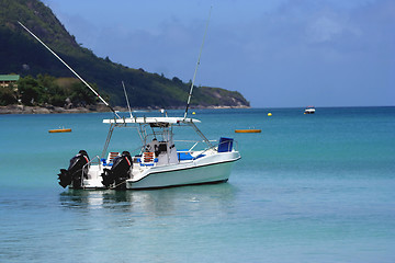 Image showing waiting boat on blue lagoon