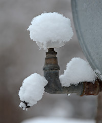 Image showing outdoor metal faucet covered by snow