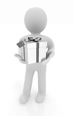 Image showing 3d man and gift with red ribbon