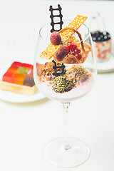 Image showing Close up of chocolate truffles in elegant glasses