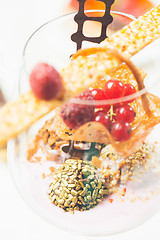 Image showing Close up of chocolate truffles in elegant glasses