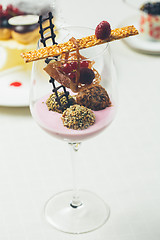 Image showing Close up of chocolate truffles in elegant glasses