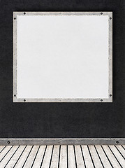 Image showing white stucco wall with a board for text