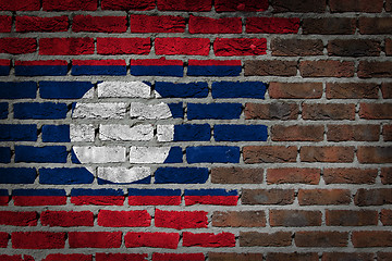 Image showing Brick wall texture with flag