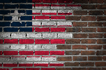 Image showing Brick wall texture with flag