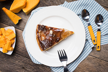 Image showing  pieces of pumpkin and pie on plate in Rustic style