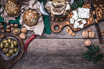 Image showing Olives, nuts and  sheep cheese with bread