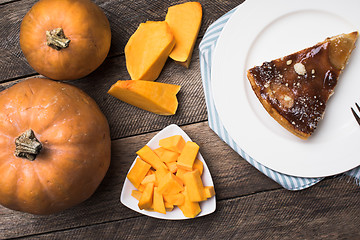 Image showing pumpkins and pie on plate on wood  in Rustic style