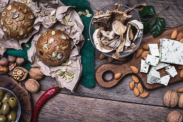 Image showing rustic style cheese with bread, cep, olives and nuts