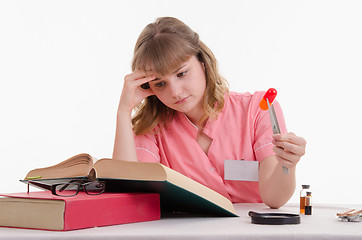 Image showing Tired student studying in the directory structure of pills