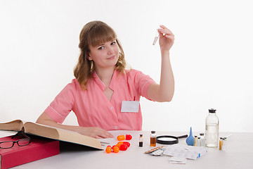 Image showing Medical student examines powder in a test tube