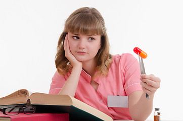 Image showing Tired student with a pill